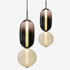 Lampada a sospensione Syro in vetro caramellato