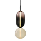 Lampada a sospensione Syro in vetro caramellato