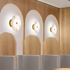 Lampada da parete LED in marmo rotondo di lusso contemporaneo in ferro per soggiorno e camera da letto