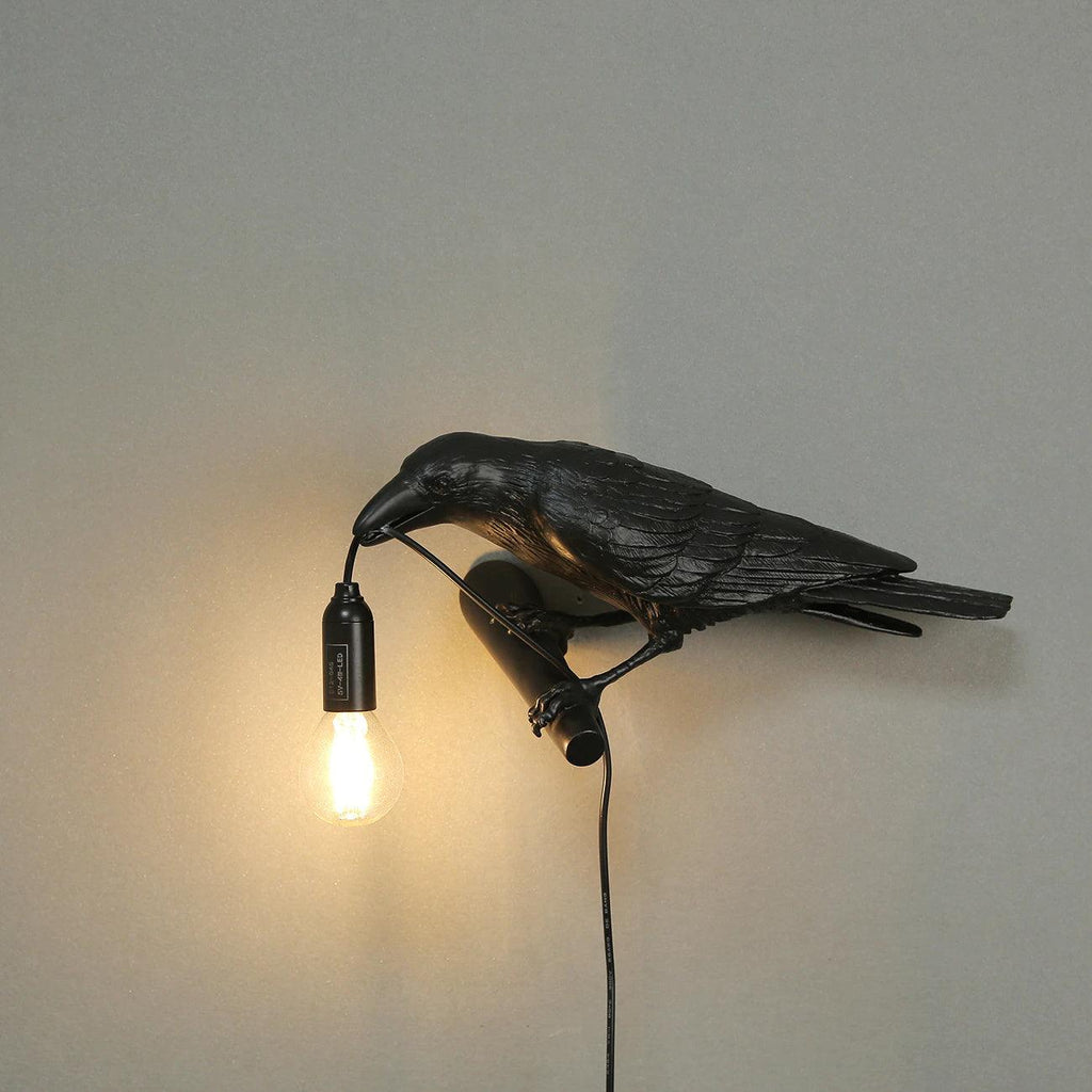 Lampada da muro a forma di uccello