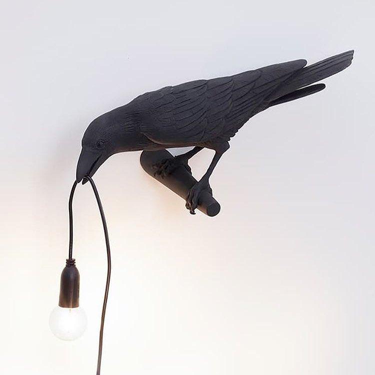 Lampada da muro a forma di uccello
