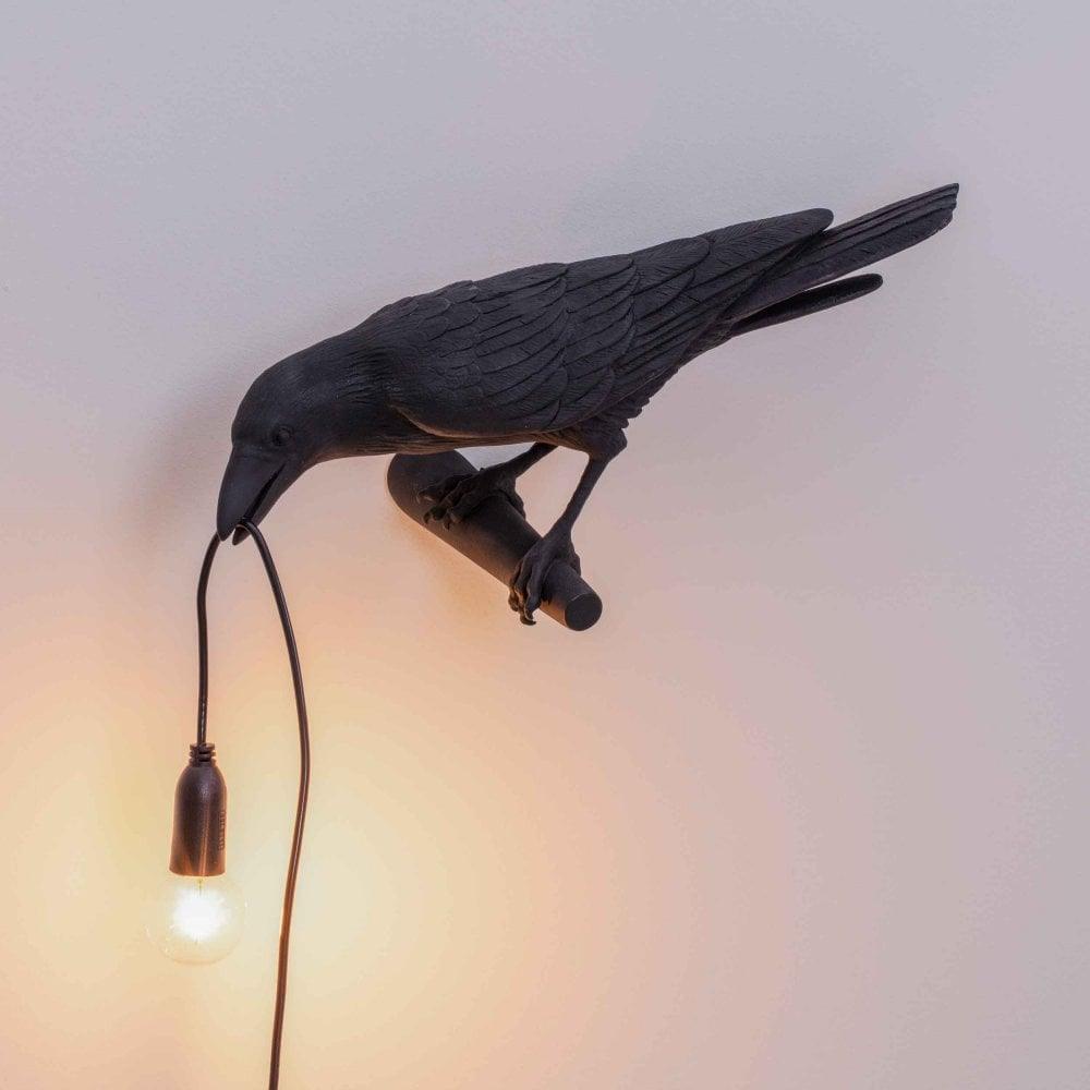 Lampada da muro a forma di uccello