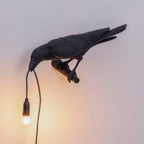 Lampada da muro a forma di uccello