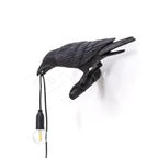 Lampada da muro a forma di uccello