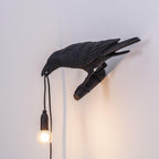 Lampada da muro a forma di uccello