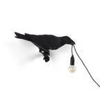 Lampada da muro a forma di uccello