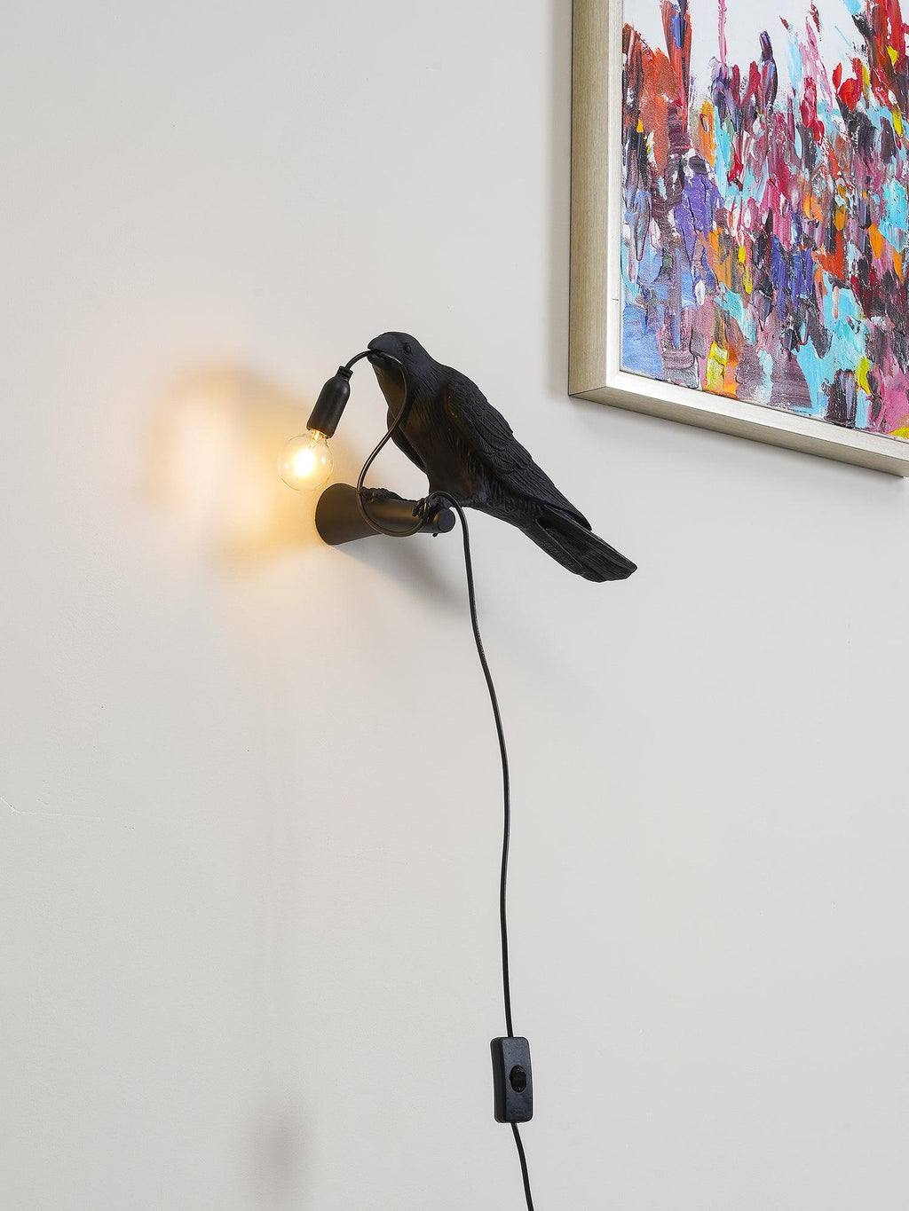 Lampada da muro a forma di uccello