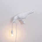 Lampada da muro a forma di uccello