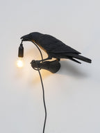 Lampada da muro a forma di uccello