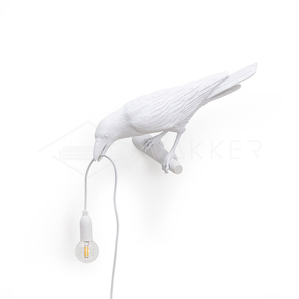 Lampada da muro a forma di uccello