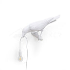 Lampada da muro a forma di uccello