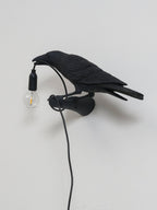 Lampada da muro a forma di uccello