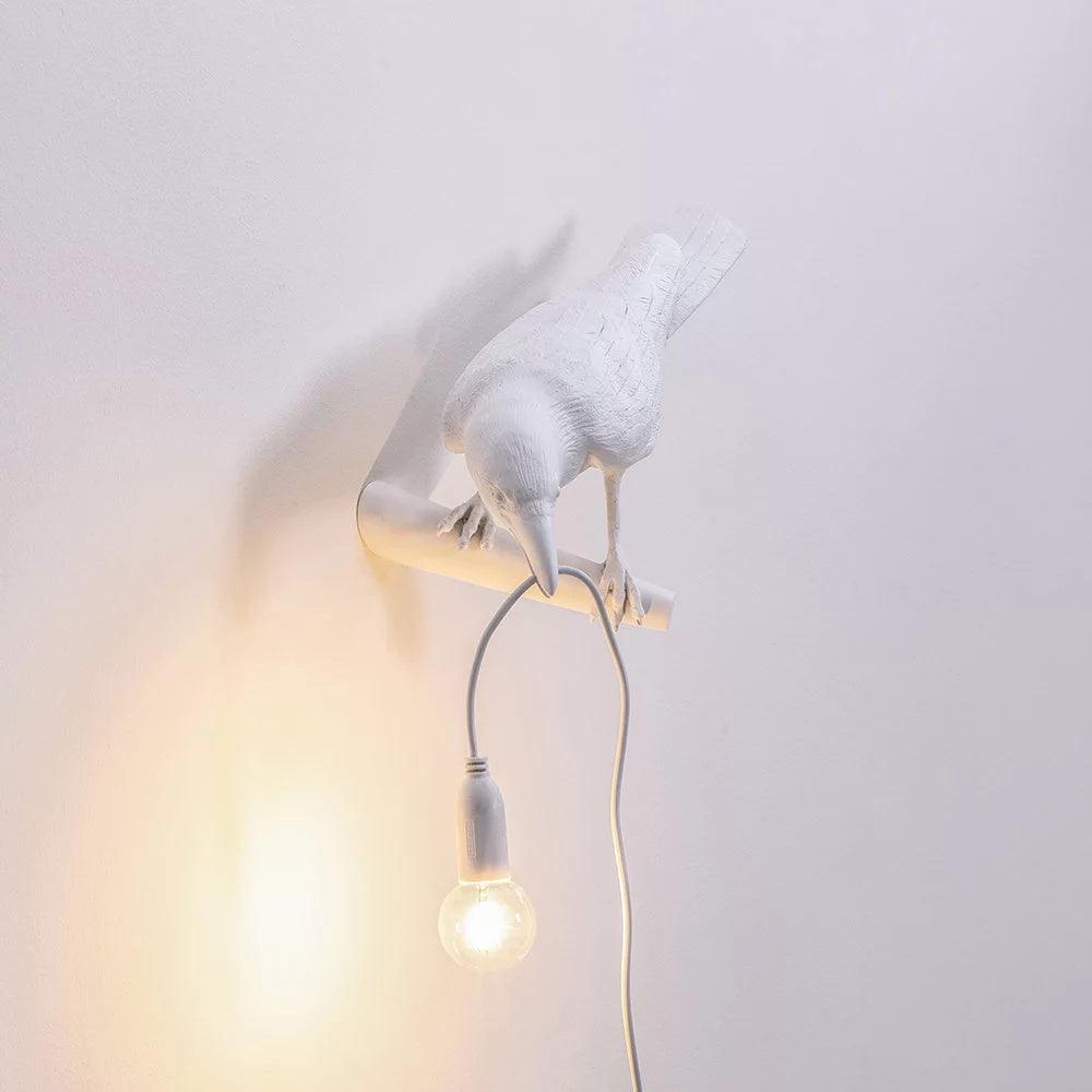 Lampada da muro a forma di uccello