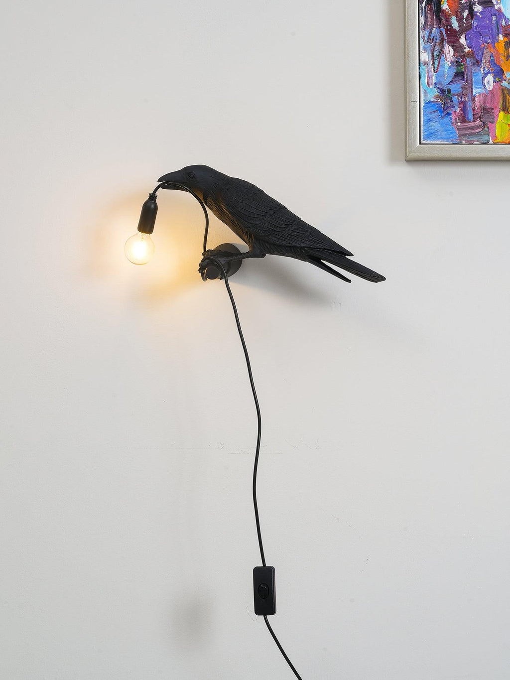 Lampada da muro a forma di uccello