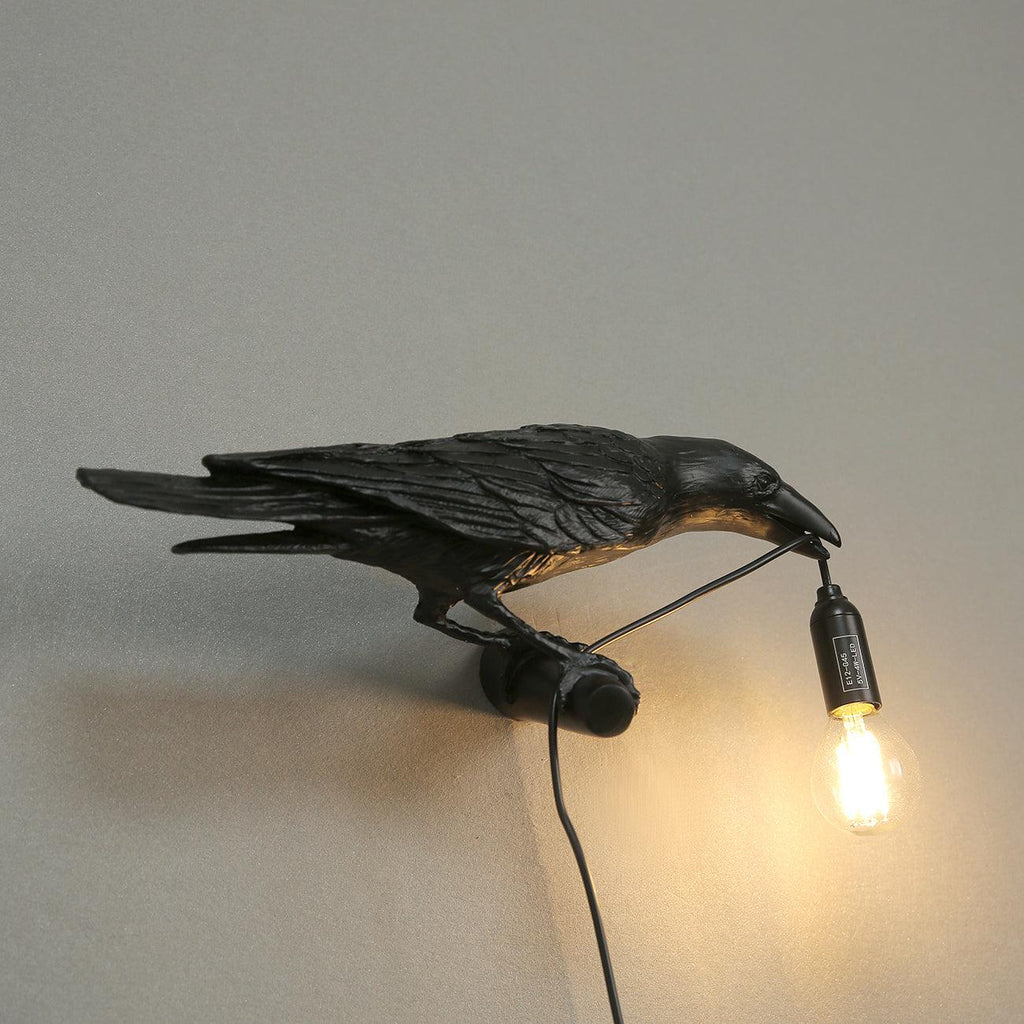 Lampada da muro a forma di uccello