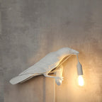 Lampada da muro a forma di uccello