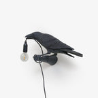 Lampada da muro a forma di uccello