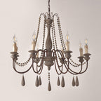 Lampadario a perline in stile candela