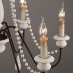 Lampadario a perline in stile candela