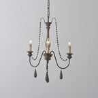 Lampadario a perline in stile candela