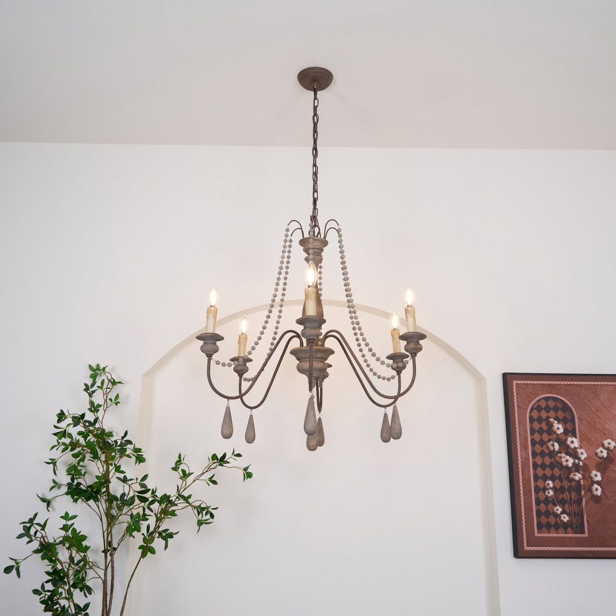 Lampadario a perline in stile candela