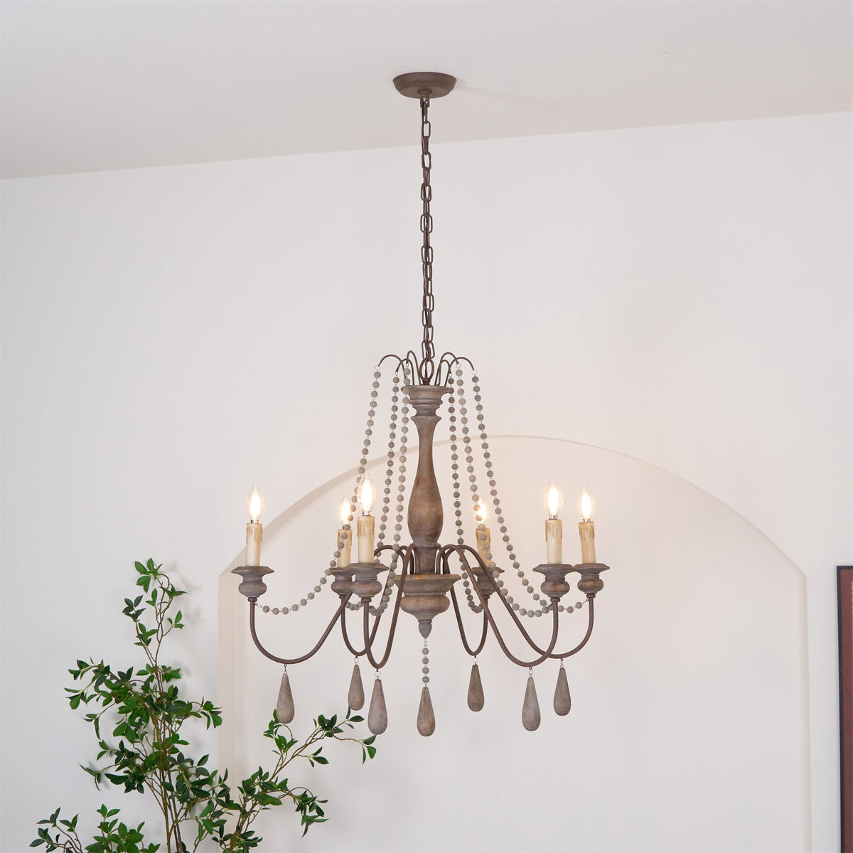 Lampadario a perline in stile candela