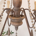 Lampadario a perline in stile candela