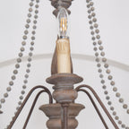 Lampadario a perline in stile candela