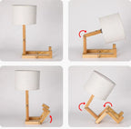 Lampada da tavolo Elara Haus con manichino in legno posabile e paralume in tessuto