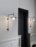 Lampada da parete Gea con braccio oscillante