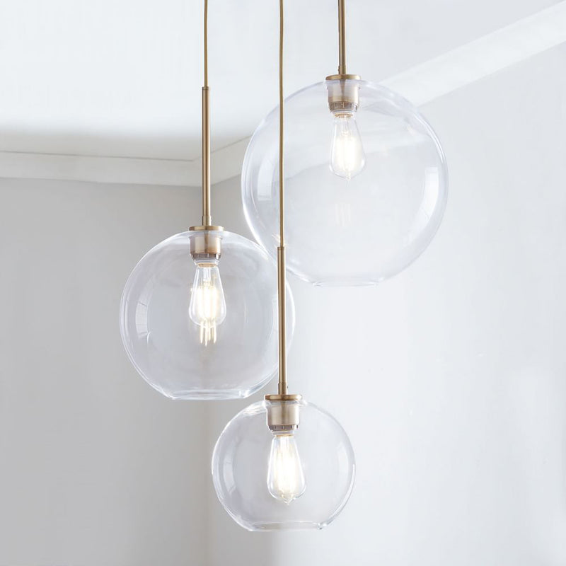 Lampada a sospensione con sfera di vetro | Design moderno in ottone