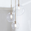 Lampada a sospensione con sfera di vetro | Design moderno in ottone