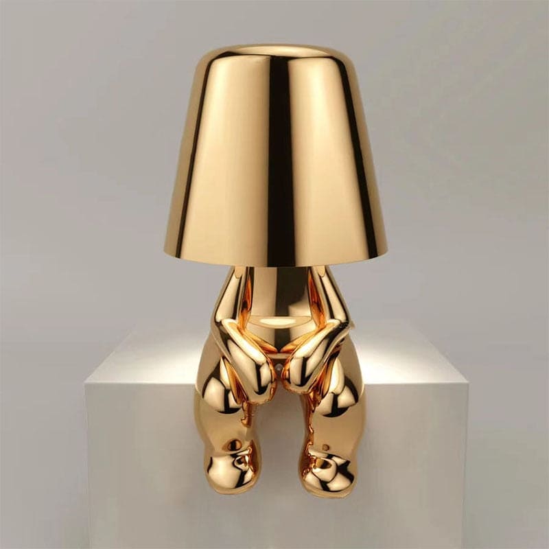 Lampada da tavolo metallica con forma artistica riflettente