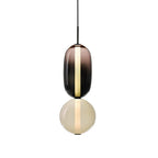 Lampada a sospensione Syro in vetro caramellato