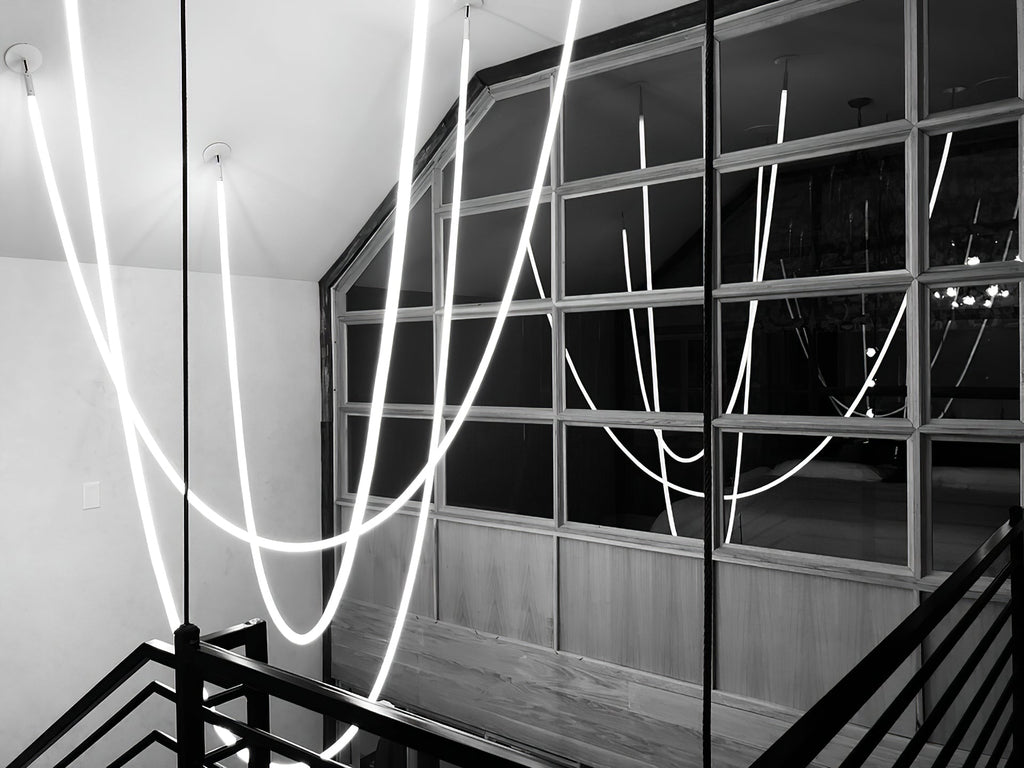 Lampada a sospensione a curva flessibile