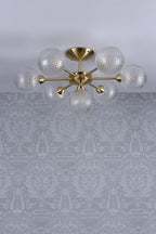 Lampada da soffitto semi-flush Laura Ashley Atherton in ottone satinato e vetro
