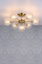 Lampada da soffitto semi-flush Laura Ashley Atherton in ottone satinato e vetro